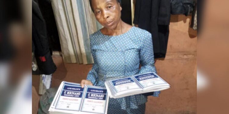 53-year-old woman found with laminated electoral materials