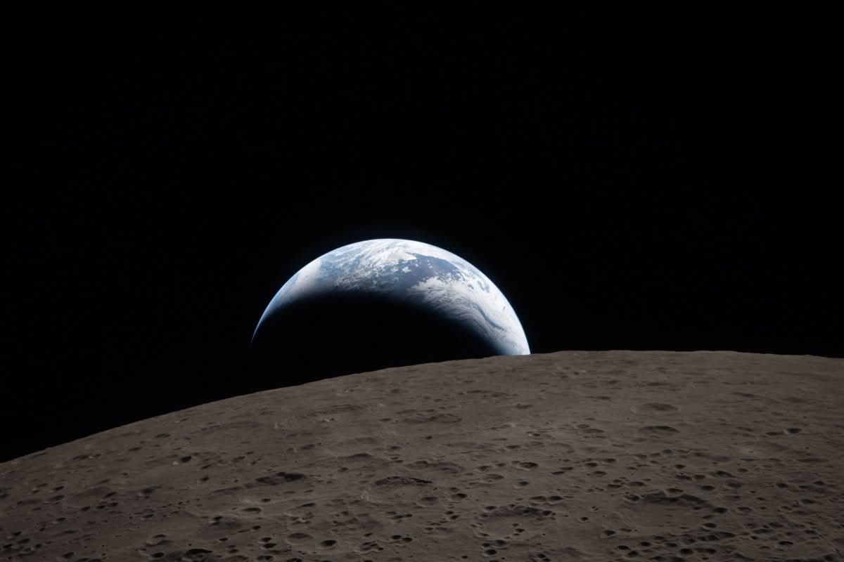 Earthset captured through the Orion spacecraft window on April 6, 2026, during the Artemis II crew's flyby of the Moon. [Handout/NASA/Getty Images via AFP]